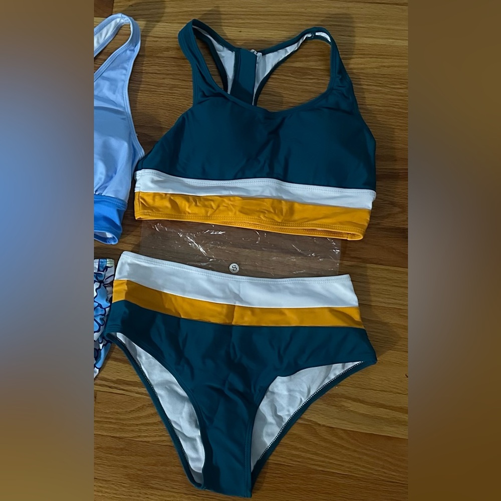 Brand new swimsuit. Never worn. Medium.